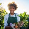 Woman farmer holds produce